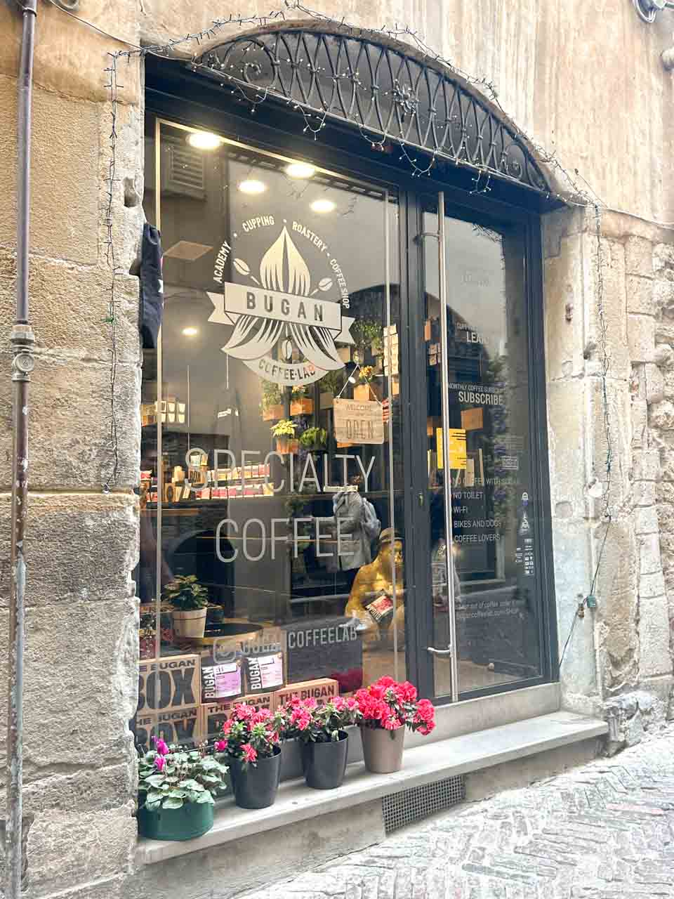 The storefront of Bugan Coffee Lab, a specialty coffee shop in Bergamo, Italy